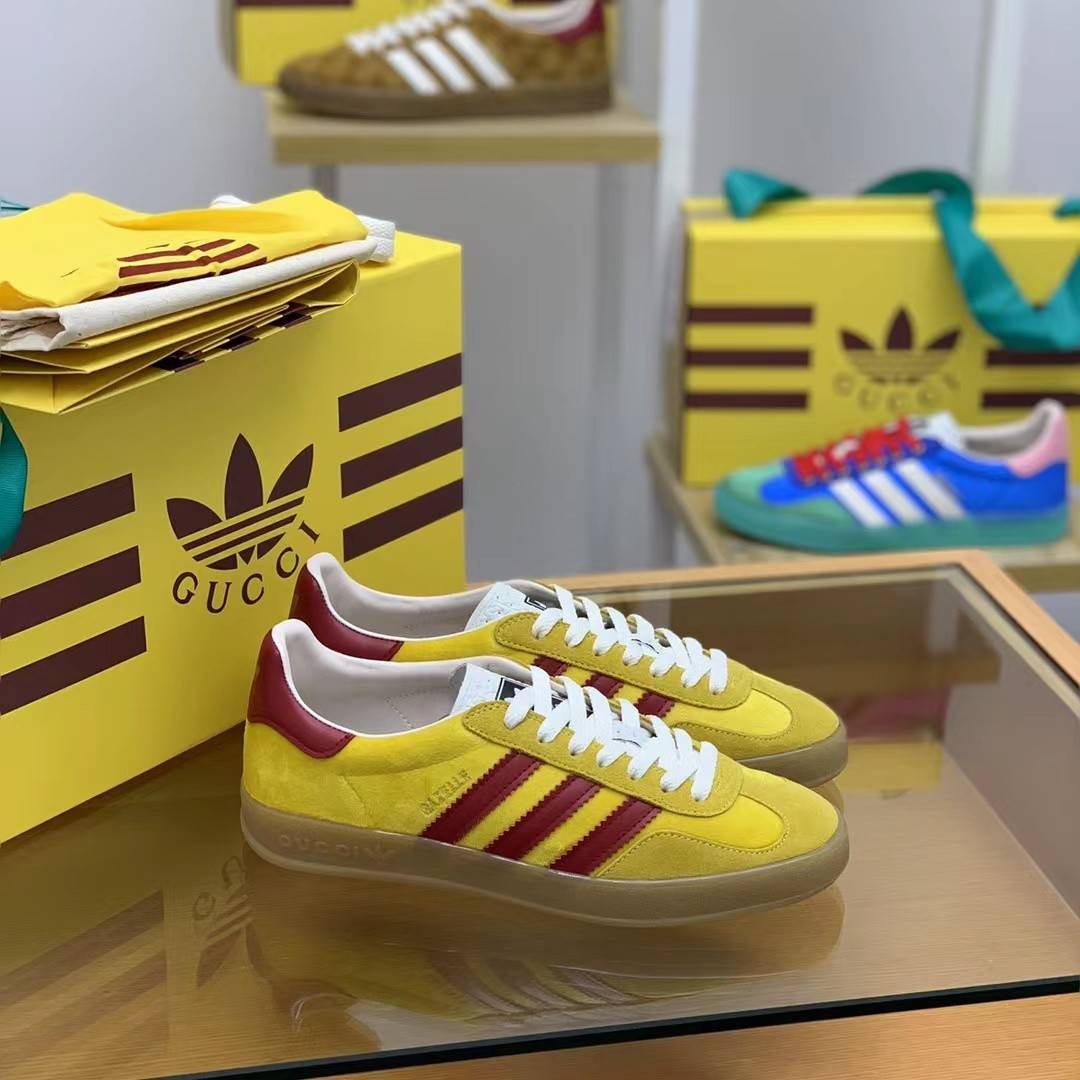 GU*I× Adidas sneakers